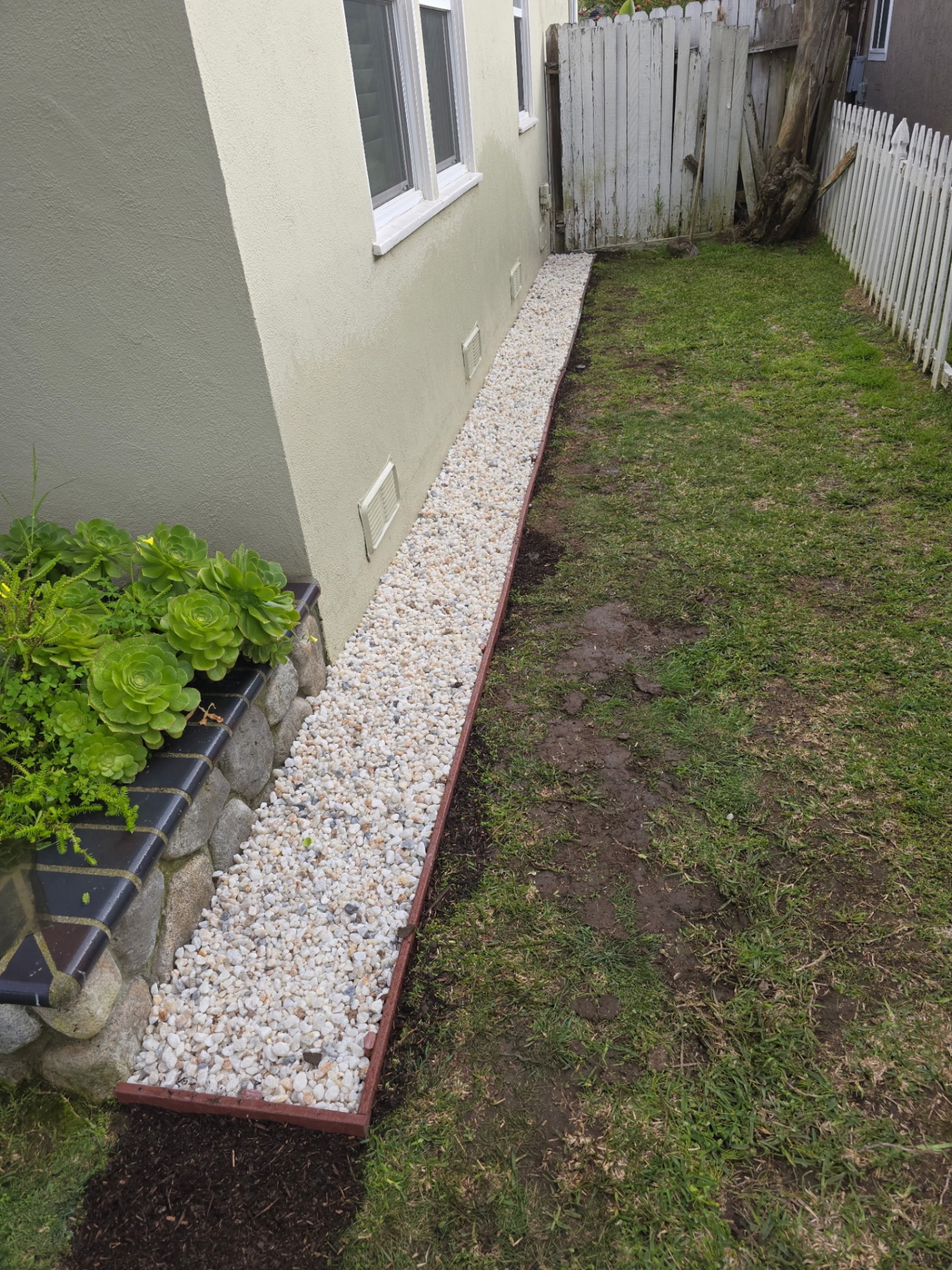 Side-yard rock bed — after